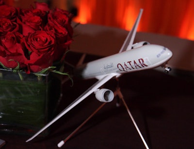 Model planes and tightly packed red roses decked each side table in sponsor Qatar Airways' upstairs lounge.