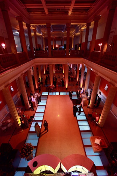 Organizers flooded the space with orange lighting to match the museum's walls, and the uplit floors were illuminated to designate the dance area.