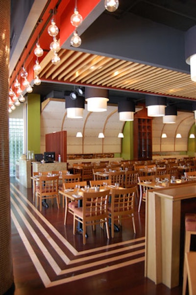 The restaurant owners, who retained many of the venue's original features, installed a new hardwood floor and added splashes of colour to the walls.