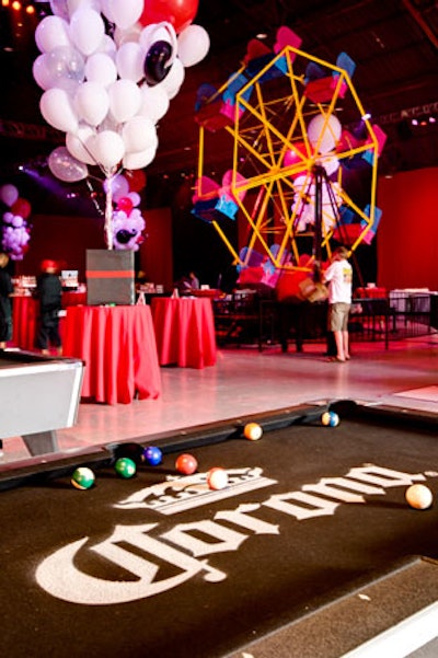 Pool tables and a Ferris wheel provided entertainment for guests of Maxim's Hot 100 party at Barker Hangar.
