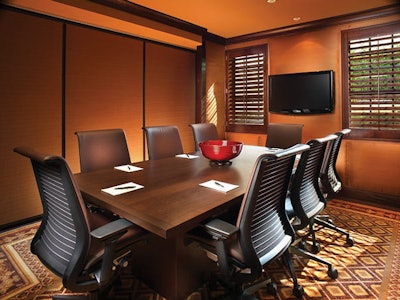 The new executive boardroom at the Brazilian Court has international teleconferencing equipment and a wide-screen plasma monitor for presentations.