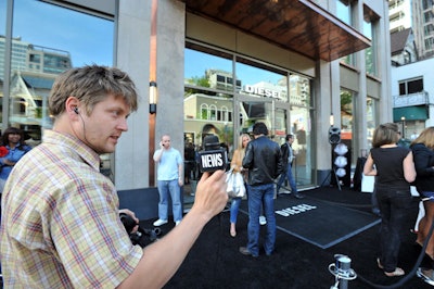 Television news crews interviewed guests as they arrived.