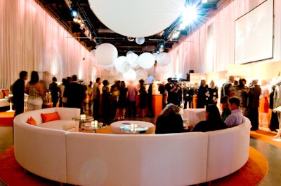 Event organizers used two curved sectionals from Contemporary Furniture Rentals to provide seating for guests at either end of the event space.