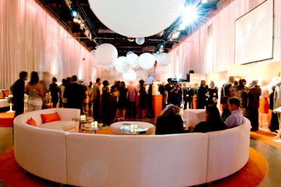 Event organizers used two curved sectionals from Contemporary Furniture Rentals to provide seating for guests at either end of the event space.