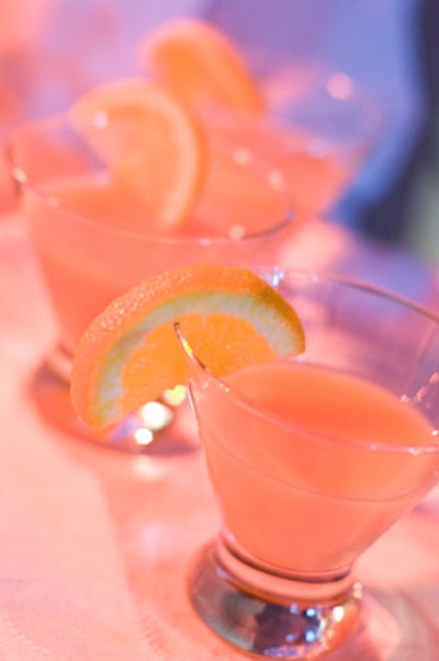 Servers passed orange juice martinis to guests as they arrived.