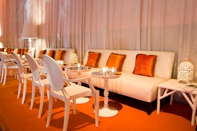 Event designer Bill Fulghum used white furnishings from Contemporary Furniture Rentals to create a lounge area that ran the length of the room.