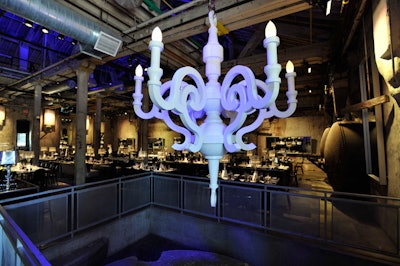 Two oversize white Moooi chandeliers, from Contemporary Furniture Rentals, hung on either side of the walkway just inside the doors of the Fermenting Cellar.