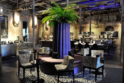 A circular purple settee—surrounded by Mademoiselle Missoni chairs by Philippe Starck and mirror-topped baroque cocktail tables—provided a focal point in the centre of the room.