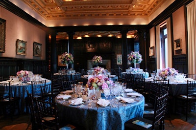 Blue linens, accented by rich brown swirls, complimented the Mantle Room's dark wood paneling.