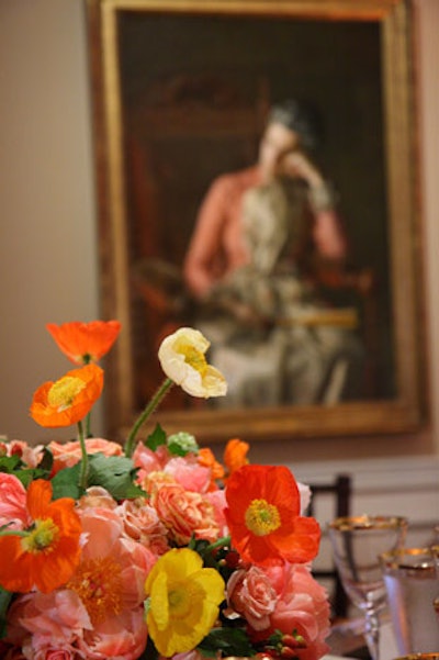 Arrangements of delicate yellow and orange poppies and pink roses topped some of the dinner tables.