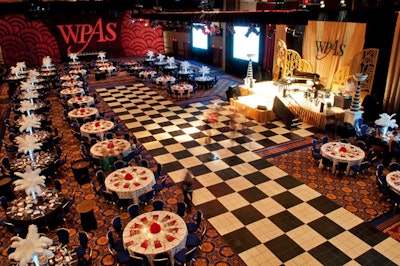 The dining area was set in front of a checkered dance floor and stage.