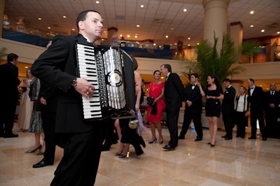 An accordion player performed French café classics at the entrance to the ballroom.