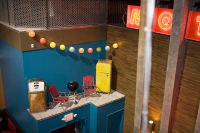A retro barbeque vignette sits above an exit from the main room.