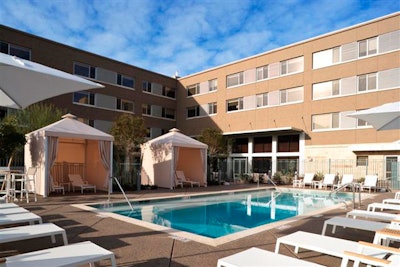 Cabanas surround the pool.