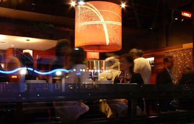 Pourtal has dark lighting and warm tones, along with pour-your-own wine stations.