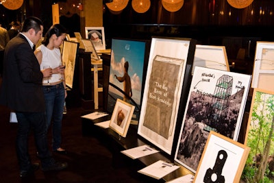 Some of the art open for bidding included a 46- by 36-inch ink-on-paper piece showing the cover of Olav Westphalen's The Big Book of Book Knowledge, as well as Tony Oursler's 41- by 36-inch all-red work containing an inserted video of a human eye.