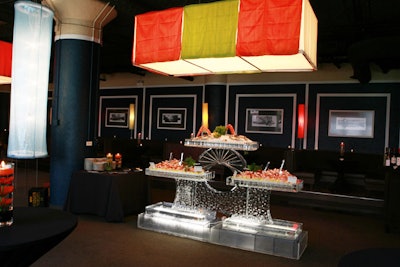 Candy-colored fabrics surrounded light fixtures, and food stations included a raw bar.