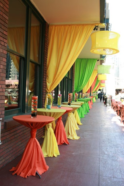 Highboys on the riverside patio wore linens in the party's signature bright hues.