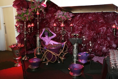 A grape-themed installation, complete with a model in a fruit-filled tub, accented the wine bar.