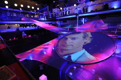Clips from CBS scripted series like The Mentalist were projected on four circular screens.