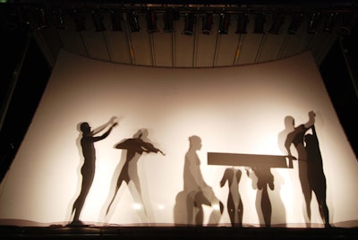 New Century Dance company performed a shadow dance from behind a white screen.