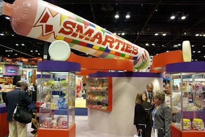 Smarties crowned its booth with a giant inflatable replica of the sour candy.