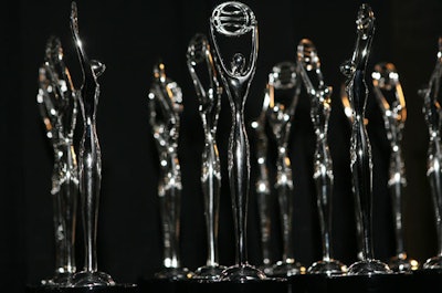 Clio statuettes honor accomplishments in advertising, design, and interactive media.