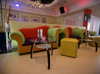 Owner Steven Pellegrino custom designed the lime green, orange, and purple sofas in the upper bar area.