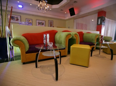 Owner Steven Pellegrino custom designed the lime green, orange, and purple sofas in the upper bar area.