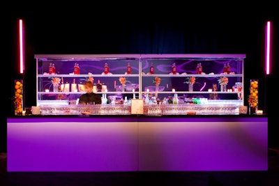 Dalzell Productions created the room's three wooden main bars with mirrored shelves.
