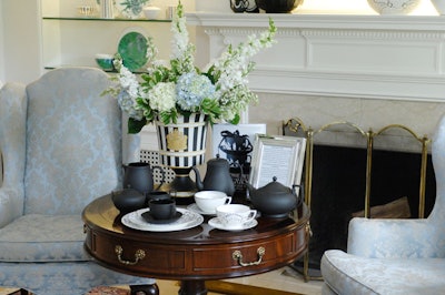 Wedgwood's Black Basalt tea set—originally designed in 1768—was prominently displayed in front of the fireplace.