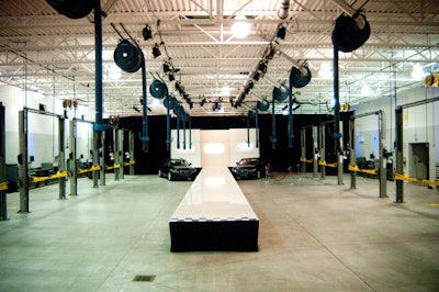 Bustle worked with 64 Steps to design the runway for the show, held in the dealership's garage.