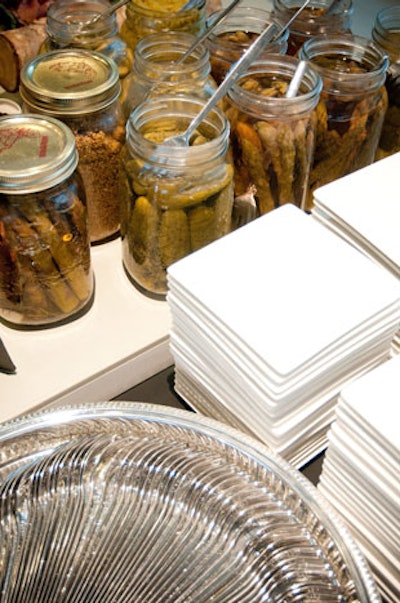 Jars of pickled vegetables accompanied a selection of charcuterie at one of the food stations.