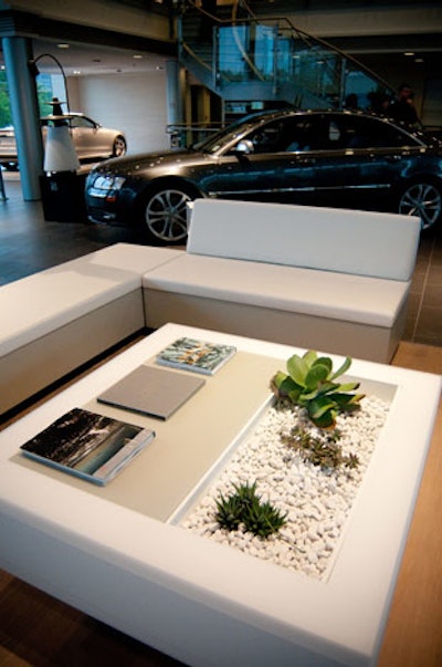 White lounge furniture provided seating on the main floor of the dealership.