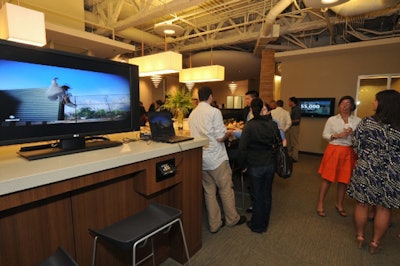Some 150 guests had cocktails in the office's reception area.