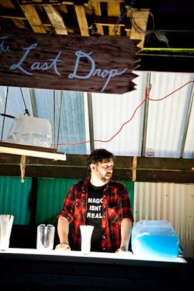 At artist Dean Baldwin's installation, an eco-friendly bar set up on the south patio, servers offered drinks out of repurposed and recycled plastic bottles.