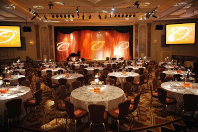 Textured fabrics, all in shades of orange, decorated the stage.