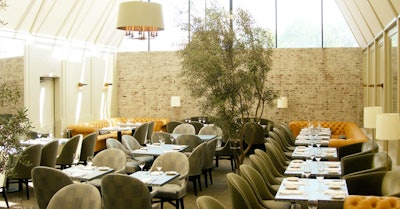 A glass ceiling provides plenty of natural light in the dining room at Tavern.