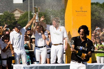 Black Watch team captain Nacho Figueras ended the daylong festivities by spraying the crowd with champagne.