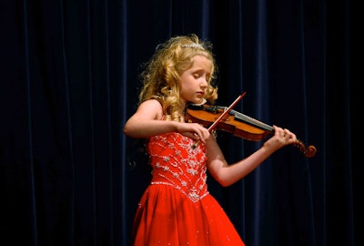 Seven-year-old violinist Brianna Kahane performed for 20 minutes during dinner.