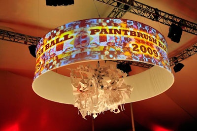 Using poster board, guests cut out shapes that Marwen staffers assembled into a sculpture, which rose to the ceiling of the tent as dinner began.