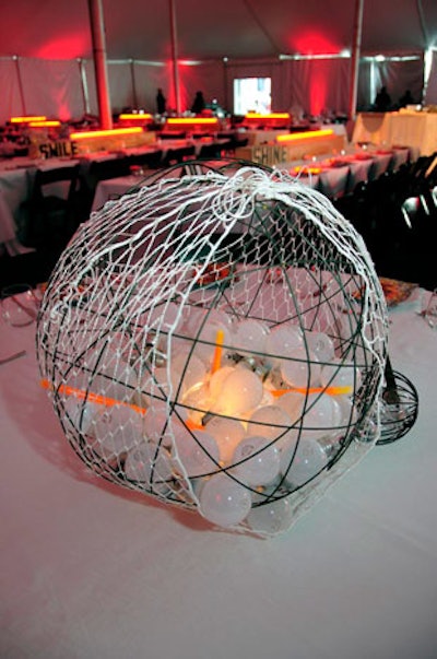 On some tables, mesh-enclosed wire globes held light bulbs and glowsticks.