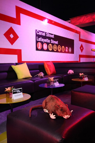 Plush rats scattered about the space served as take-home toys for guests.