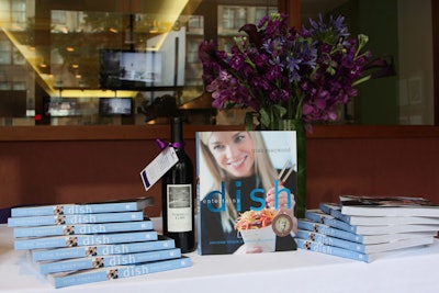 At the close of the event, each guest received an autographed copy of Trish Magwood's new cookbook, Dish Entertains, and a bottle of red wine, tied with a purple ribbon.