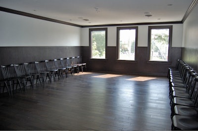The 24-seat private dining room features large windows and a treetop view.