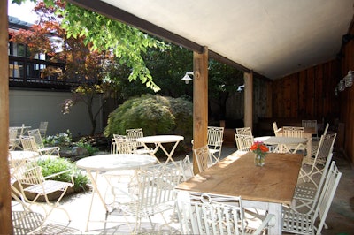 The 75-seat garden has mature plantings, a fish pond, and is partially covered.