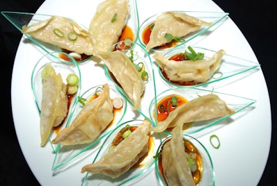 Eggwhites Special Event Catering provided passed hors d'oeuvres like chicken gyoza dumplings with citrus ponzu sauce.