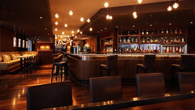 The ground-level Bar Dupont has suede and leather seating as well as floor-to-ceiling windows onto Dupont Circle.