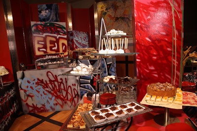 Graffiti-covered cubes displayed traditional German desserts, such as strudel and rustic fruit tarts.