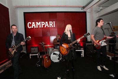 A red wall and Campari logo backed the stage setup.